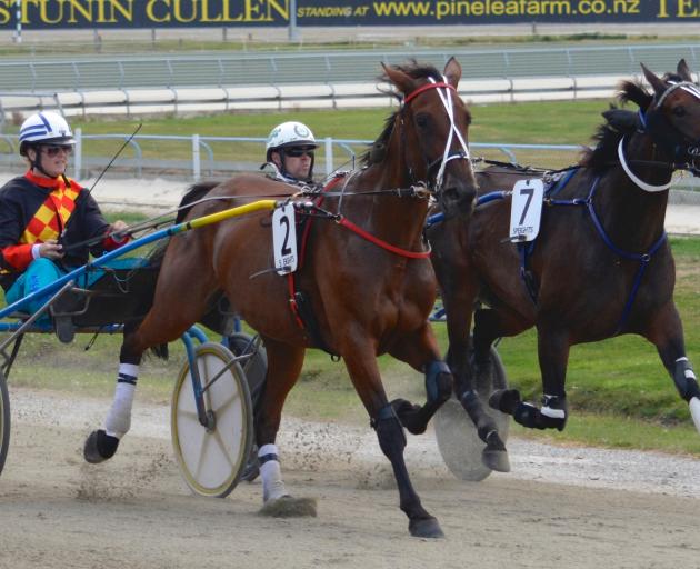 Kash Valley and driver Loren Lester (outer) hold out Lone Star Lad and Mark Hurrell to win at...