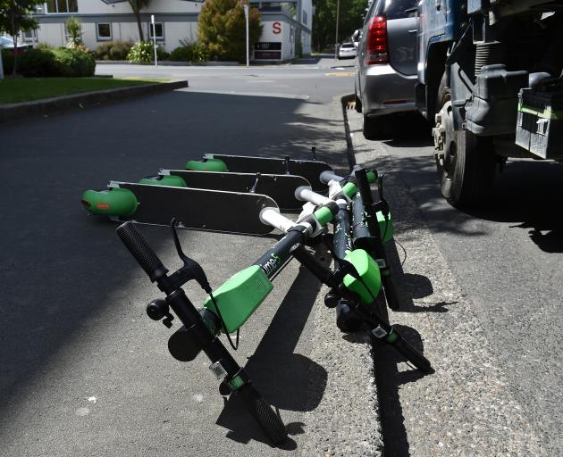 Three Lime scooters lie on the footpath outside Otago Polytechnic yesterday. The Dunedin City...