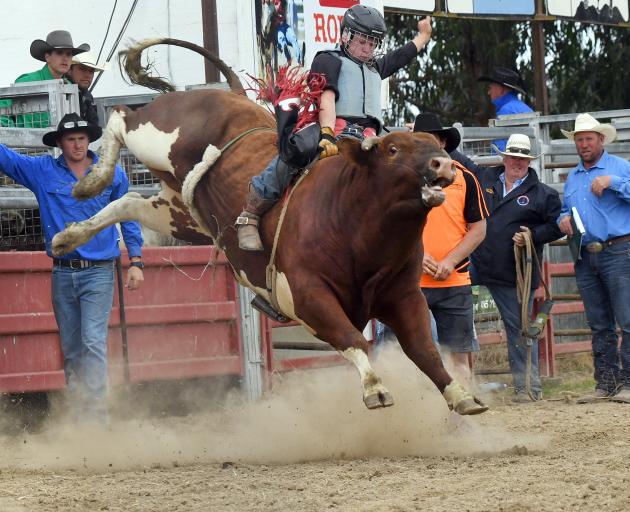 Loche Cowan (15), of Kurow, competes in the Trans-Tasman bullride at the Outram rodeo earlier this month. Photo: Stephen Jaquiery