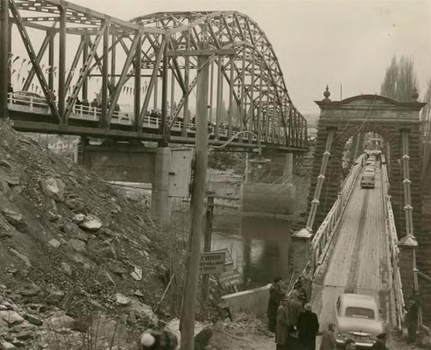 Alexandra's new "blue" bridge is opened on July 5, 1958, alongside the original bridge, which...