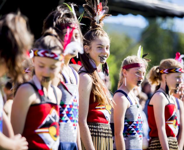 Arrowtown School kapa haka group member Eliana Collins (12) finds a light moment during the...