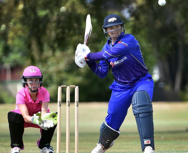 Otago Sparks batsman Suzie Bates latches on to a full toss, watched by ND keeper Olivia Lobb,...