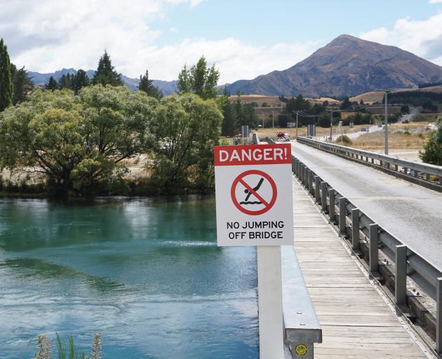Signs have been erected at the Albert Town Bridge by the New Zealand Transport Agency banning people from jumping off the bridge. Photo: Sean Nugent