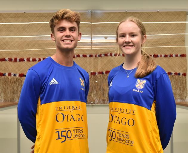 University of Otago Football Club players Oban Hawkins and Erin Roxburgh show off the 150th anniversary strip at a function yesterday to mark the season opening. Photo: Gregor Richardson
