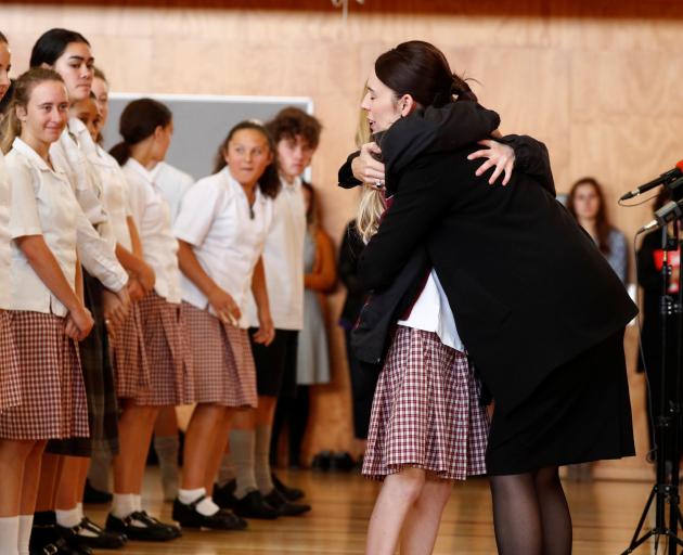 Prime Minister Jacinda Ardern hugs a pupil during her visit to Cashmere High School, in Christchurch, yesterday. Photo: Reuters