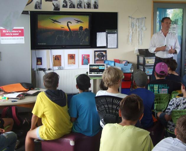 Military researcher Peter den Tek speaks to Alexandra Primary pupils on Friday about some of the...