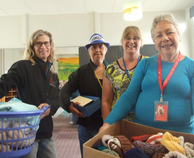 Stand Children’s Services staff members (from left) Paula Hutton, Judy Dunick, Timea Welsh and...