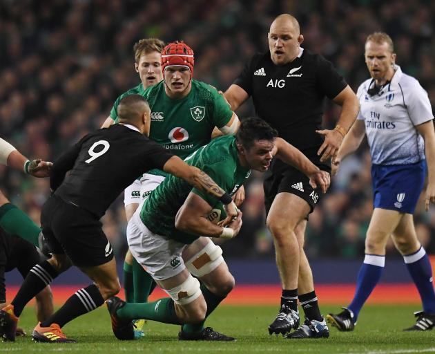 Ireland's James Ryan gets tackled by All Black Aaron Smith. Photo: Reuters