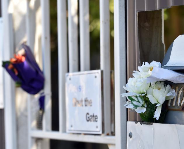 Flowers outside the An-Nur Early Childhood Education and Care Centre Dunedin, which was closed all week after very few Muslim children attended as they were fearful following the Christchurch attacks on Friday. Photo: Peter McIntosh