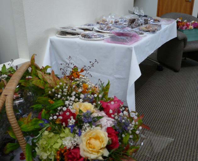 Home baking and flowers provided by South Otago community members for Muslim mourners attending a...