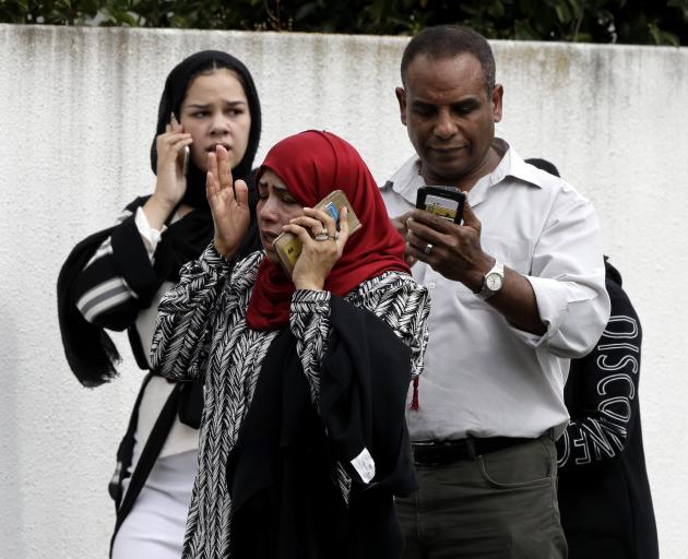 Christchurch residents react in horror to news of Friday's shootings. Photo: AP