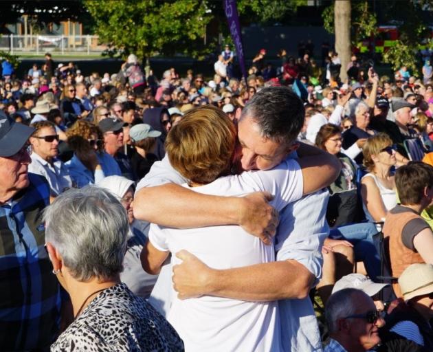 People embrace during a vigil in Hagley Park, Christchurch. Photo: RNZ 
