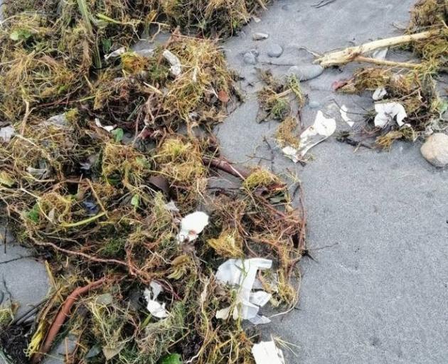 Tonnes of rubbish from an old Fox Glacier landfill is washing up on beaches along the Westland...
