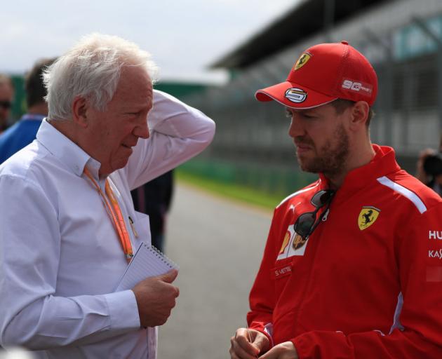 Charlie Whiting talks to Sebastian Vettel yesterday ahead of the season-opening Australian Grand...