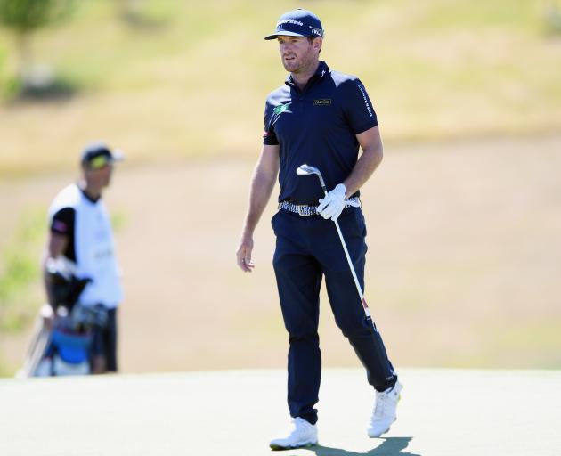 Josh Geary walks down the first fairway during the final round of the New Zealand Open at The...