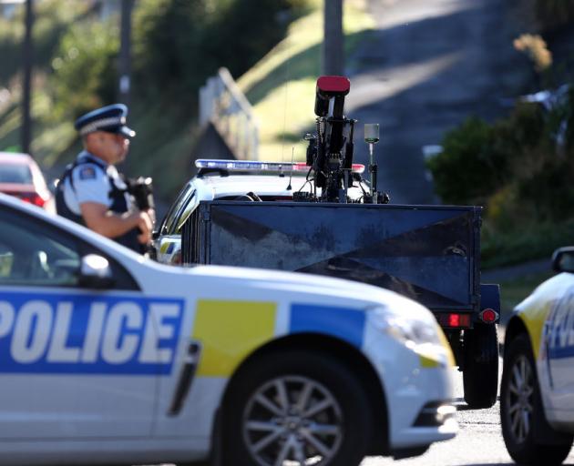 A bomb disposal robot arrives as police investigate a property at Somerville Street. Photo: Getty...