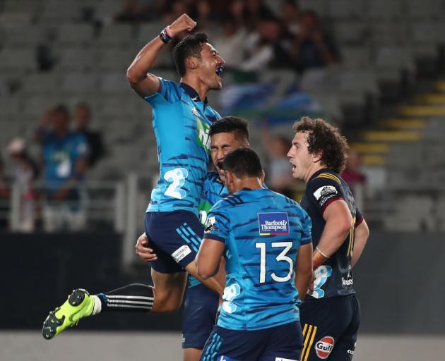 Melani Nanai celebrates a Blues try with Rieko Ioane and TJ Faiane during their win over the...