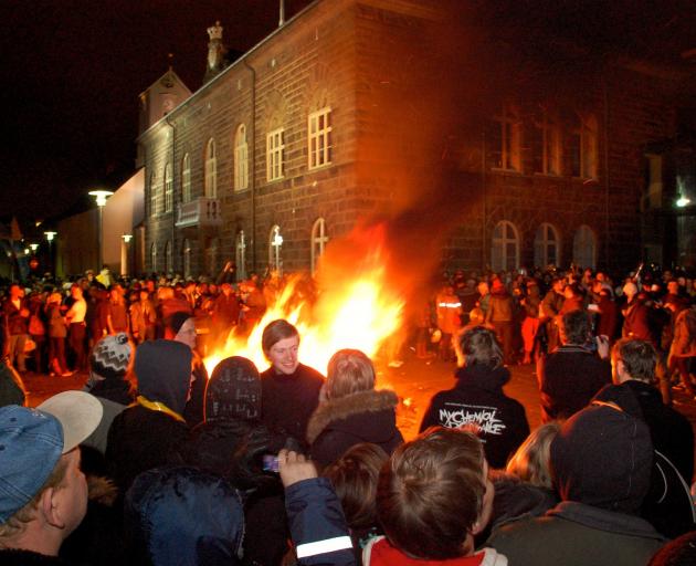People gather outside the Iceland Parliament in Reykjavik, 2009 during mass protests that led to...