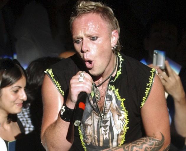 Keith Flint of the British group Prodigy performs during the Gianni Versace mens' fashion collection for the Spring/Summer 2005. Photo: AP