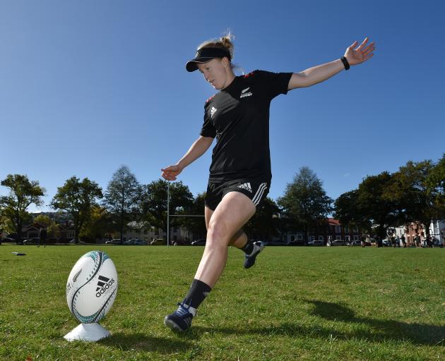 Black Ferns halfback Kendra Cocksedge boots a ball during a kicking session at the North Ground...