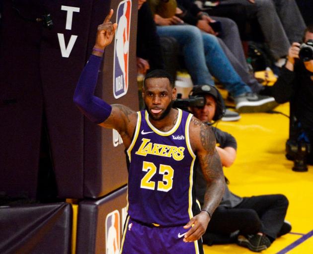 LeBron James celebrates after moving past Michael Jordan into fourth on the all-time NBA scoring...