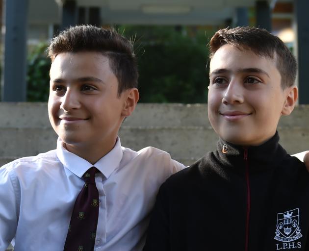 Jordanian brothers Ala'a (left) and Mohammed Mayyas celebrate Race Unity Day at Logan Park High School. Photos: Gregor Richardson