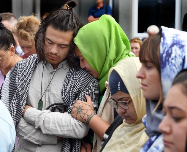 Supporters mourn outside the Al Huda mosque yesterday. PHOTOS: STEPHEN JAQUIERY