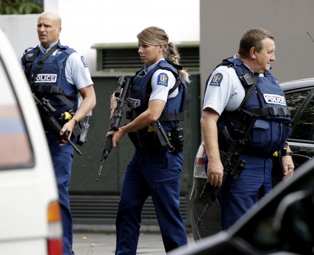 Armed police patrol outside a mosque in central Christchurch. Photo: AP