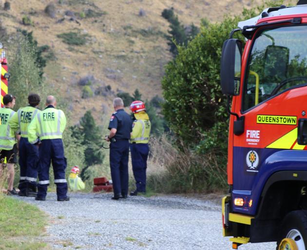 Firefighters at the scene of a scrub fire near Queenstown. Photo: Paul Taylor