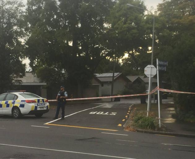 Armed police have cordoned off a street. Photo: NZME