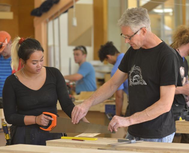 Otago Polytechnic lecturer Alan Fraser helps construction trade skills carpentry student Susha...