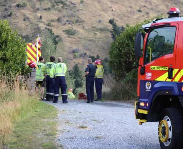 Firefighters at the scene of a Queenstown blaze they believe was started by a  a fleeing driver....