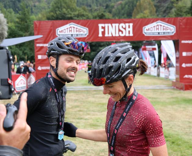 Samara Sheppard and Kyle Ward share a smile at the finish line of the Motatapu on Saturday.PHOTO:...