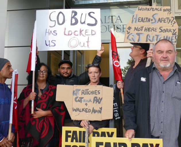 Four Ritchies bus drivers, along with First Union organiser Ken Young and other union members,...