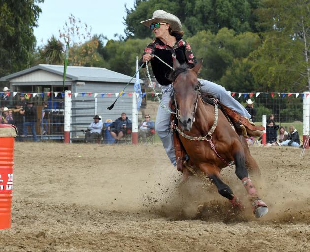 Rhondine Long, of Oamaru, on her way to winning the open barrel race at the Outram Rodeo last month, a win which helped her to the national title last weekend. Photo: Stephen Jaquiery