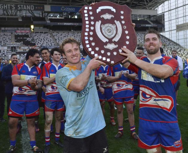 Team captains Jack McHugh (University, left) and Charles Elton (Harbour) hold the Championship Shield aloft after drawing their Dunedin club rugby final at Forsyth Barr Stadium last year. Photos: Gerard O'Brien