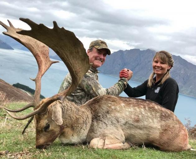 Shuker with a client and a fallow stag. Photo: Glen Dene Hunting 