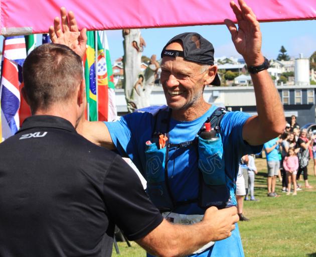 Eric Ross (66), of Hakataramea, greets Alps 2 Ocean Ultra race director Mike Sandri, of Oamaru,...