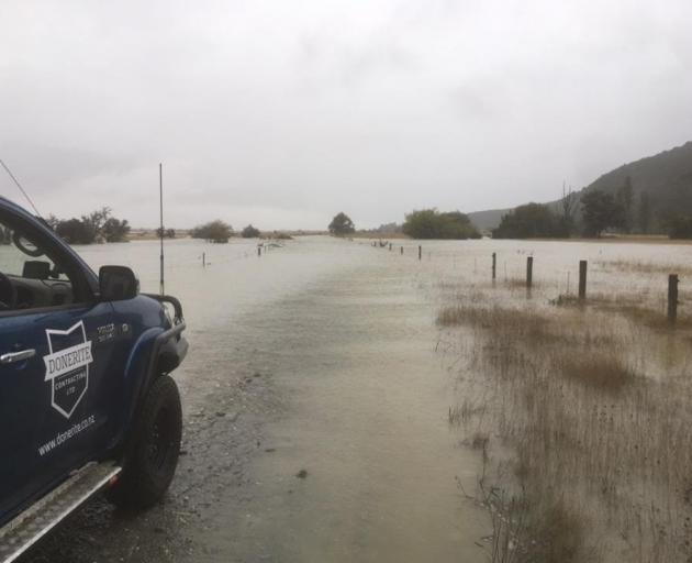 Part of the Glenorchy-Paradise Rd was closed due to surface flooding yesterday. PHOTO: DOWNER 