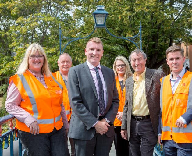 Wearing their orange vests are (from left) Waste Management Ltd compliance co-ordinator Trudy Hutchison, operations and fleet supervisor Allen Nesbit, account manager Rebecca Bedwell and Otago regional manager Greg Nel, flanking University of Otago proper