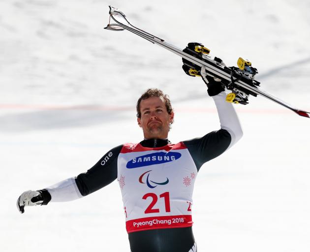 Adam hall celebrates his gold medal in the standing skiing. Photo: Reuters