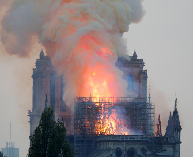 Smoke billows from Notre Dame Cathedral after a fire broke out. Photo: Reuters