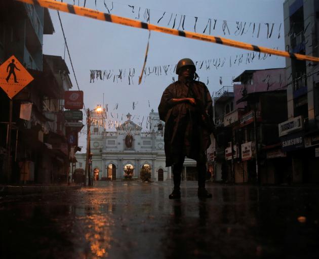 A soldier stands guard at St. Anthony's Shrine, days after a string of suicide bomb attacks on...