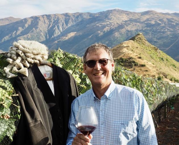 Nic Soper contemplates becoming a barrister while enjoying a drop of his own pinot noir, The Imbiber. Photo: Mountain Scene