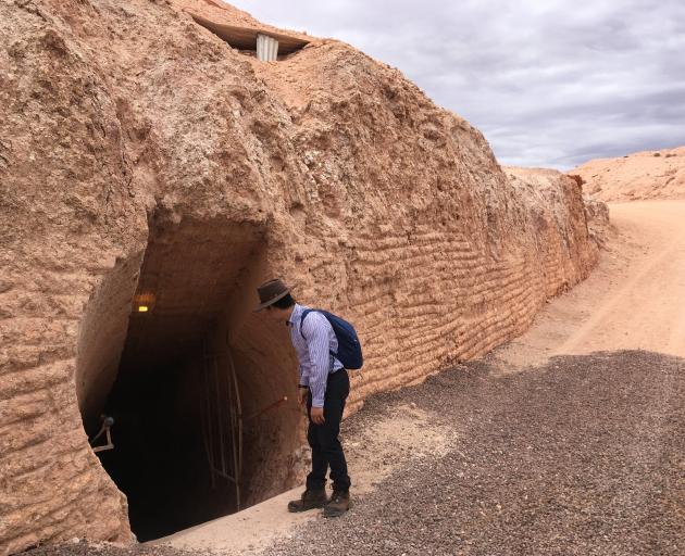 A Ghan host looks down into the underground Serbian Orthodox Church at Coober Pedy. PHOTO: PAM JONES