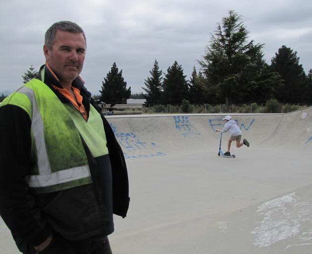 Alexandra BMX Club president Tony Nelson checks out graffiti at the Alexandra skatepark. Photo: Pam Jones