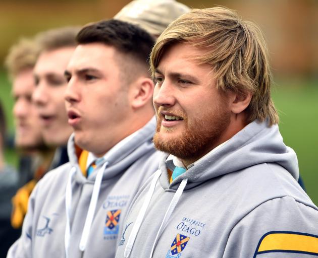 University prop Angus Williams (right) watches his side play Kansai Universities at Logan Park...