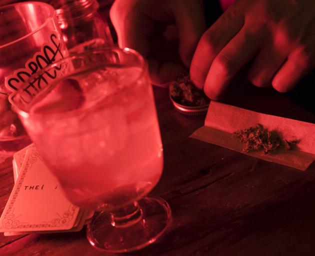 A man rolls a joint at a Spleef NYC canna-cocktail party in New York. Photo: AP