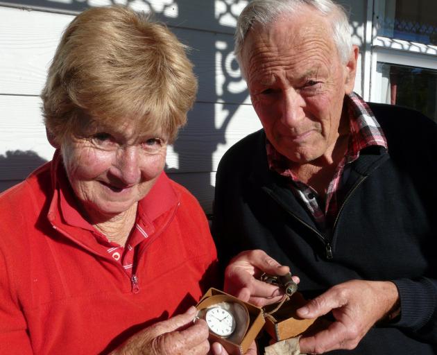 Heather and Alan Duthie, of Clydevale, examine some of Mr Duthie’s great uncle Robert’s World War 1 Gallipoli possessions before Anzac Day. Photo: Richard Davison