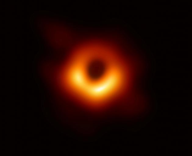 The first ever photo of a black hole, taken using a global network of telescopes, conducted by...
